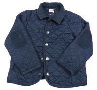 Tmavomodrá prošívaná šusťáková jarní zateplená bunda name it.