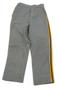 Čierno-biele kockované nohavice s okrovým pruhom Zara
