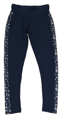 Tmavomodré športové legíny s kvietkami