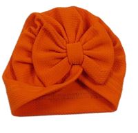 Tmavooranžová vzorovaná turbanová čepice s mašlí