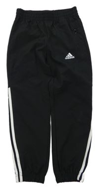 Černé sportovní šusťákové kalhoty s logem Adidas