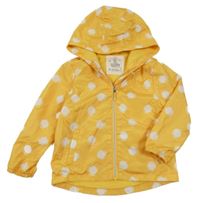 Hořčicovo-bílá puntíkatá šusťáková jarní bunda s kapucí F&F