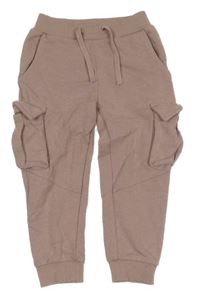 Pudrové tepláky s kapsami Name it