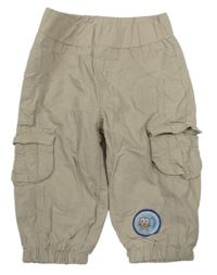 Béžové plátenné podšité nohavice s vreckami a nášivkou Topolino