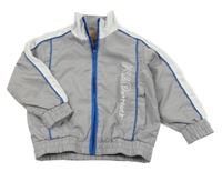 Sivo-modro-biela šušťáková jarná bunda s nápisom