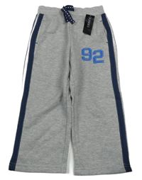 Nové - šedé melírované teplé tepláky s číslem a pruhy St. Bernard