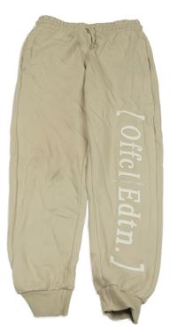 Béžové tepláky s nápisem George