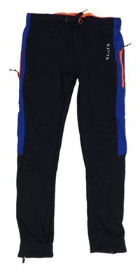 Tmavomodré sportovní funkční legíny s logem kipsta