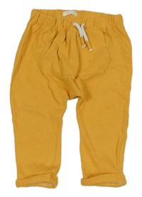 Tmavožluté turecké tepláky s kapsou Next