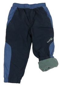 Tmavomodro-modrošedé šušťákové zateplené nohavice