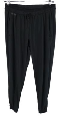 Dámske čierne šušťákové cuff nohavice Kalenji