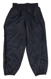 Tmavomodré šušťákové nepromokavé funkčné nohavice Quechua