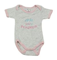 Sivé melírované body s růžovým lemem a nápisom