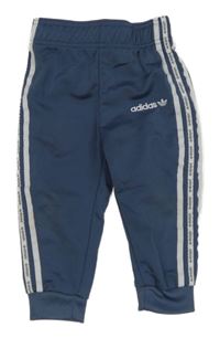 Modrošedé športové tepláky s logom Adidas