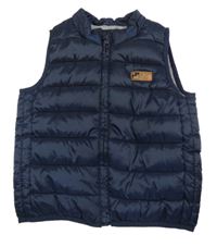 Tmavomodrá šušťáková zateplená vesta Kiabi