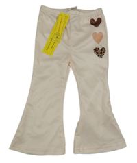 Nové - Pudrové flare kalhoty se srdíčky Shein