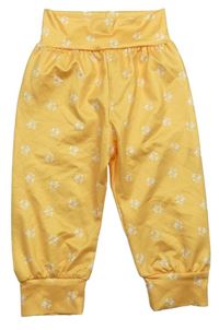 Žlutooranžové ľahké nohavice s kvietkami