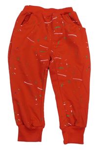 Červené tepláky s potlačou