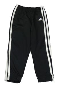 Černo-bílé sportovní tepláky s pruhy a logem Adidas