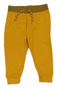 Hořčicové tepláky s pruhovaným pasem Primark