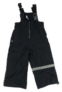 Tmavomodré šusťákové funkční laclové oteplovačky s reflexním pruhem