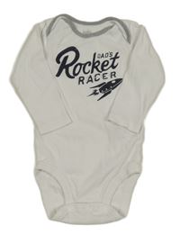 Bílé body s nápisem a raketou 