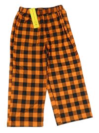 Kockovaným - Oranžovo-čierne kockované nohavice SHEIN