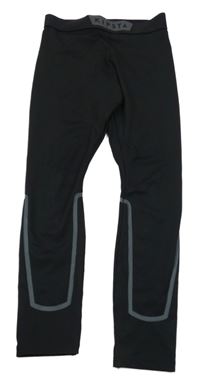 Černé sportovní legíny s proužkem a logem kipsta