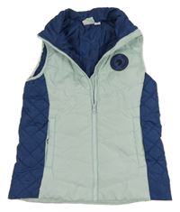 Mátovo-tmavomodrá šušťáková zateplená funkčná vesta s nášivkou Crane