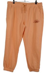 Nové - Dámské oranžové cuff tepláky se sluníčkem Primark 