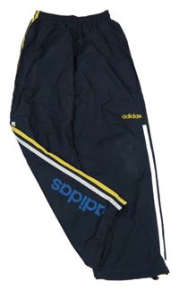 Tmavomodro-žluté šusťákové kalhoty s pruhy a logem Adidas