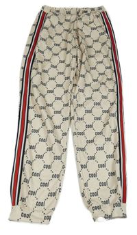 Světlebéžové tepláky s nápisy a pruhem Shein