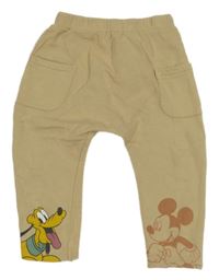 Béžové baggy tepláky s Plutem a Mickeym Next