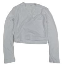 Bílé zavinovací propínací bolérko