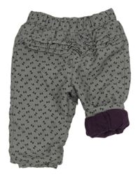 Šedé šusťáková podšité kalhoty s mašlemi a volánky