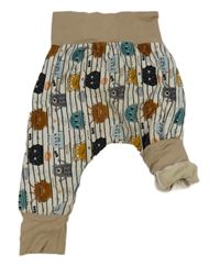 Bílo-černé pruhované zateplené tepláky s příšerkami