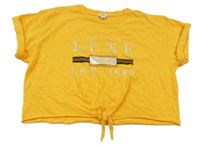 Pomerančové crop tričko s nápisem a uzlem River Island