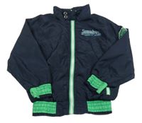 Tmavomodrá šušťáková jarná bunda s nápisom