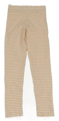 Meruňkovo-smotanové pruhované legíny H&M