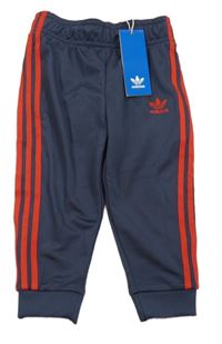 Nové - Tmavomodré sportovní tepláky s logem Adidas