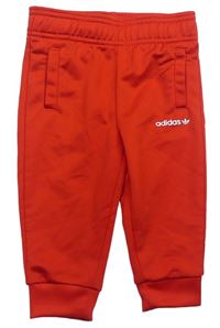 Červené športové tepláky s logom Adidas
