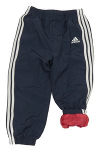 Tmavomodré šusťákové podšité cuff kalhoty Adidas