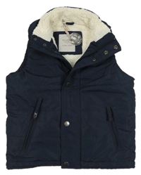 Tmavomodrá šušťáková zateplená vesta