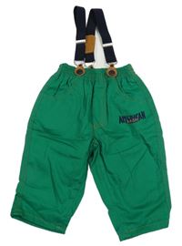 Tmavozelené plátěné podšité kalhoty s nápisy a kšandami