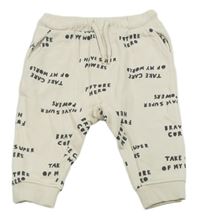Světlebéžové tepláky s nápisy H&M