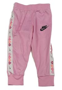 Světlerůžové sportovní kalhoy s logem Nike