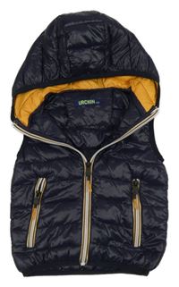 Tmavomodro-okrová šušťáková prešívaná lehce zateplená vesta s kapucňou