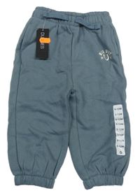 Nové - šedomodré teplé tepláky s nápisem a podkovou St. Bernard