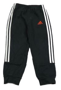 Černé tepláky s bílými pruhy a logem Adidas