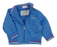 Modrá šušťáková jarná bunda s nápisom Impidimpi